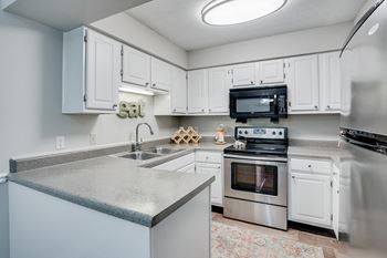 Kitchen with Stainless Steel Appliances and White Cabinetry